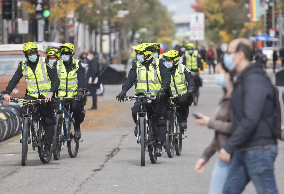 Police patrol Saint-Catherine Street in Montreal on Oct. 3, 2020. (The Canadian Press/Graham Hughes)