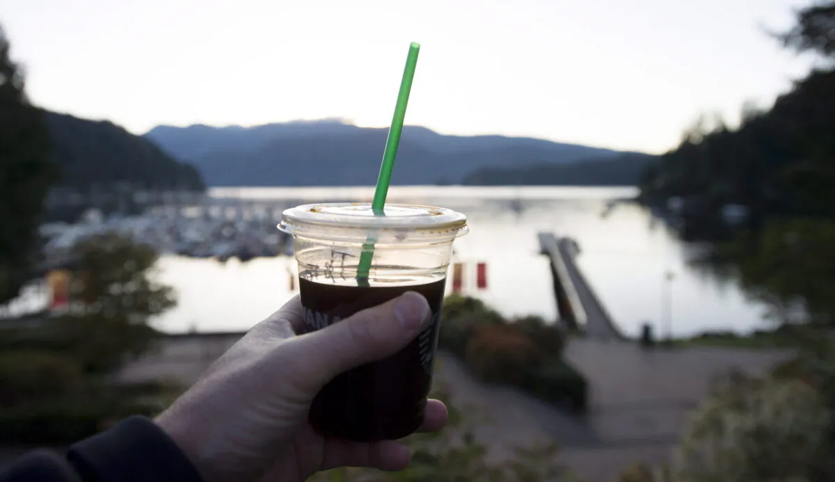 A plastic straw is pictured in a take away coffee cup in Deep Cove in North Vancouver, B.C., on May, 11, 2018. (Jonathan Hayward/The Canadian Press)