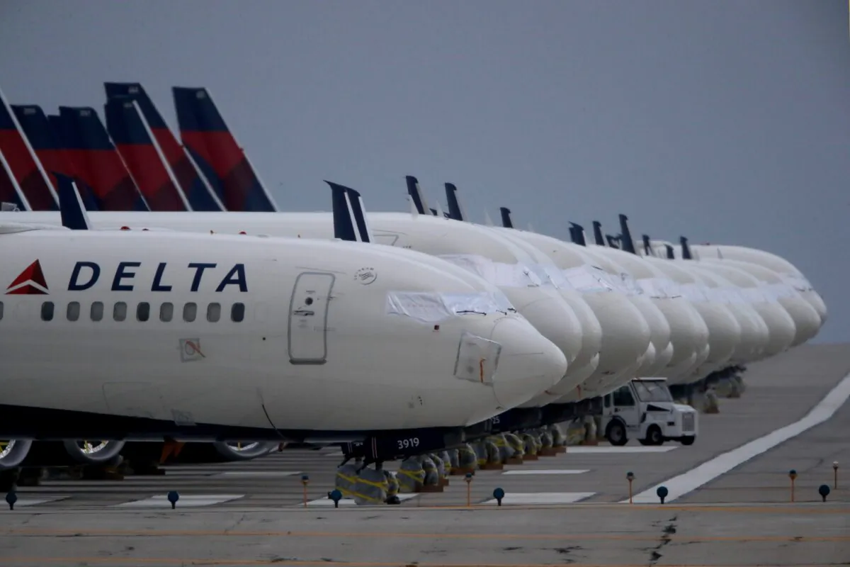 Delta Air Lines jets are parked at Kansas City International Airport, Miss., on May 14, 2020. (Charlie Riedel/AP Photo)