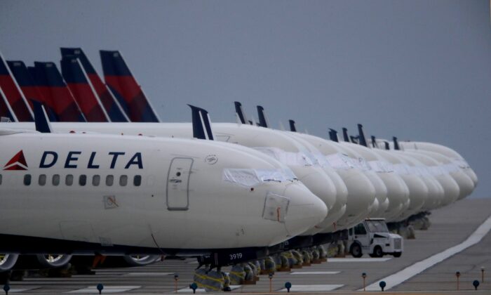 Delta Air Lines jets are parked at Kansas City International Airport, Miss., on May 14, 2020. (Charlie Riedel/AP Photo)