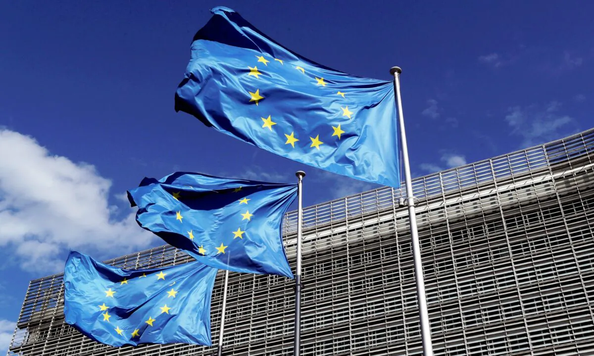 European Union flags flutter outside the European Commission headquarters in Brussels, Belgium, on Aug. 21, 2020. (Yves Herman/Reuters)