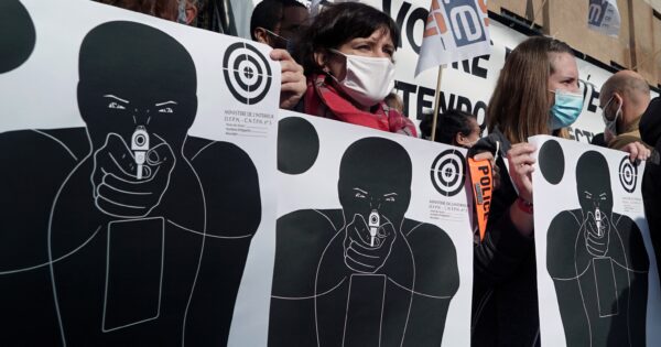 Paper shooting targets are seen during a protest by French police