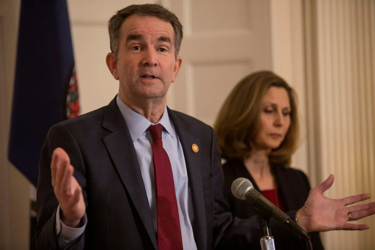 Virginia Gov. Ralph Northam, accompanied by his wife Pamela Northam, announces he will not resign during a news conference in Richmond, Va., on Feb. 2, 2019. (Jay Paul/Reuters)