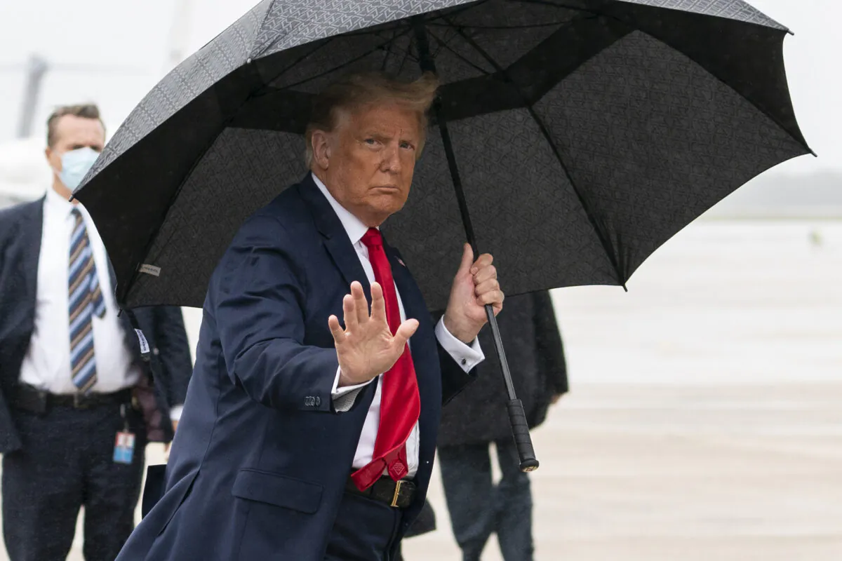 President Donald Trump boards Air Force One for a campaign rally in Sanford, Fla., in Andrews Air Force Base, Md., Oct. 12, 2020. (Evan Vucci/AP Photo)