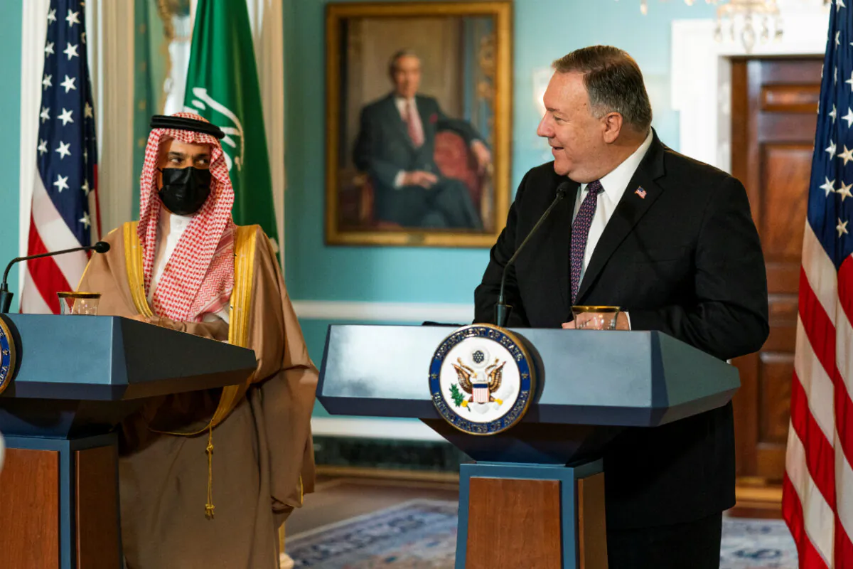 U.S. Secretary of State Mike Pompeo looks at Saudi Minister of Foreign Affairs Prince Faisal bin Farhan Al Saud as he speaks during their meeting at the State Department, in Washington, Oct. 14, 2020. (Manuel Balce Ceneta/Pool via Reuters)