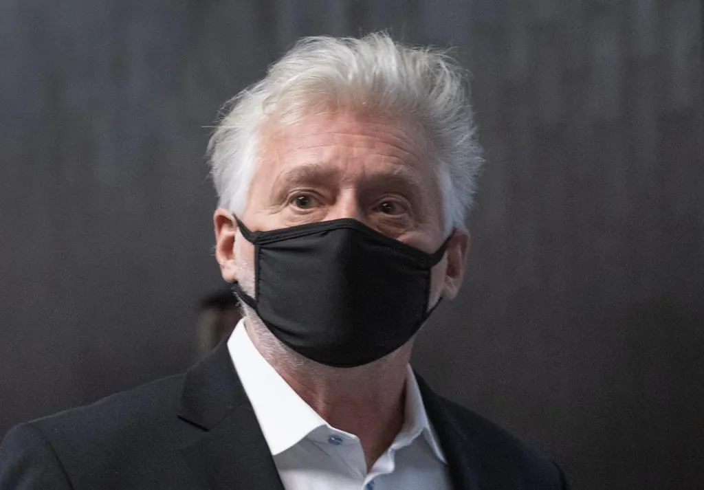 Just for Laughs founder Gilbert Rozon walks the hall of the courthouse as he arrives for the beginning of his sexual assault trial in Montreal on Oct. 13, 2020. (THE CANADIAN PRESS/Paul Chiasson)