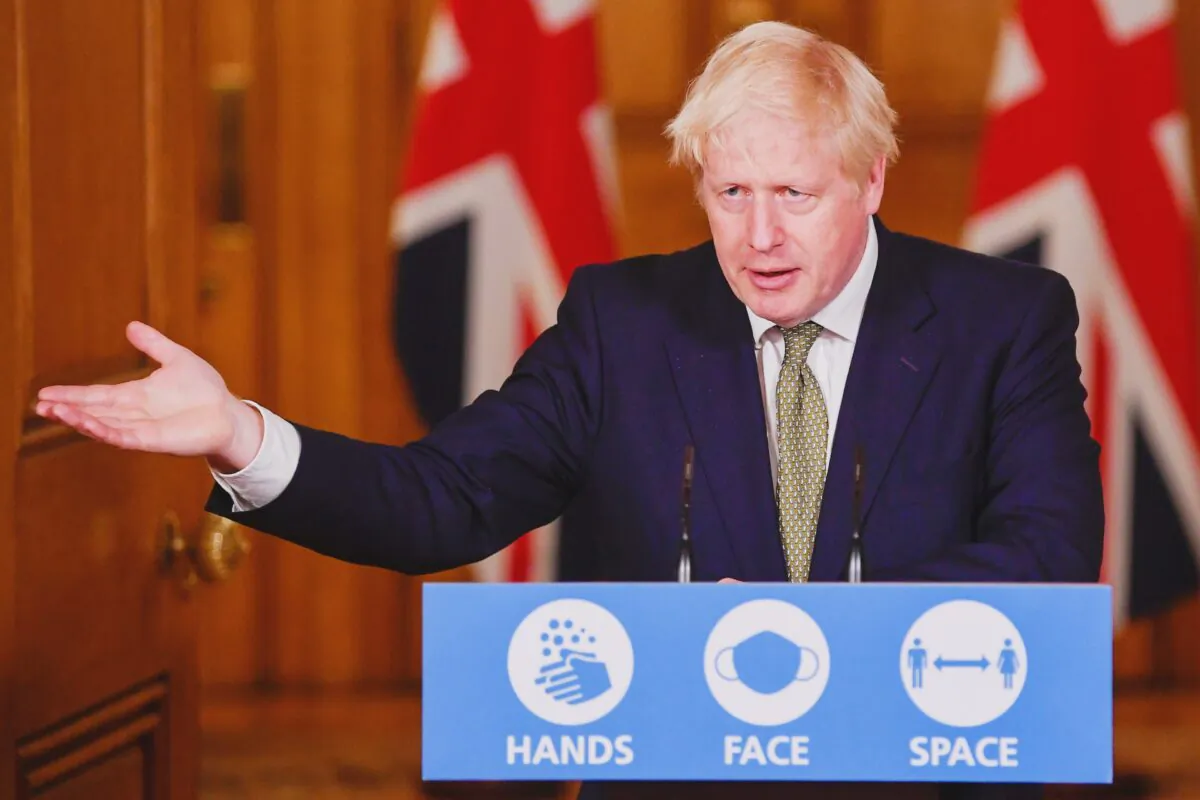 Britain's Prime Minister Boris Johnson gestures as he speaks during a virtual news conference on the ongoing situation with the CCP virus disease (COVID-19), at Downing Street, London, on Oct. 12, 2020. (Toby Melville/Pool via Reuters)
