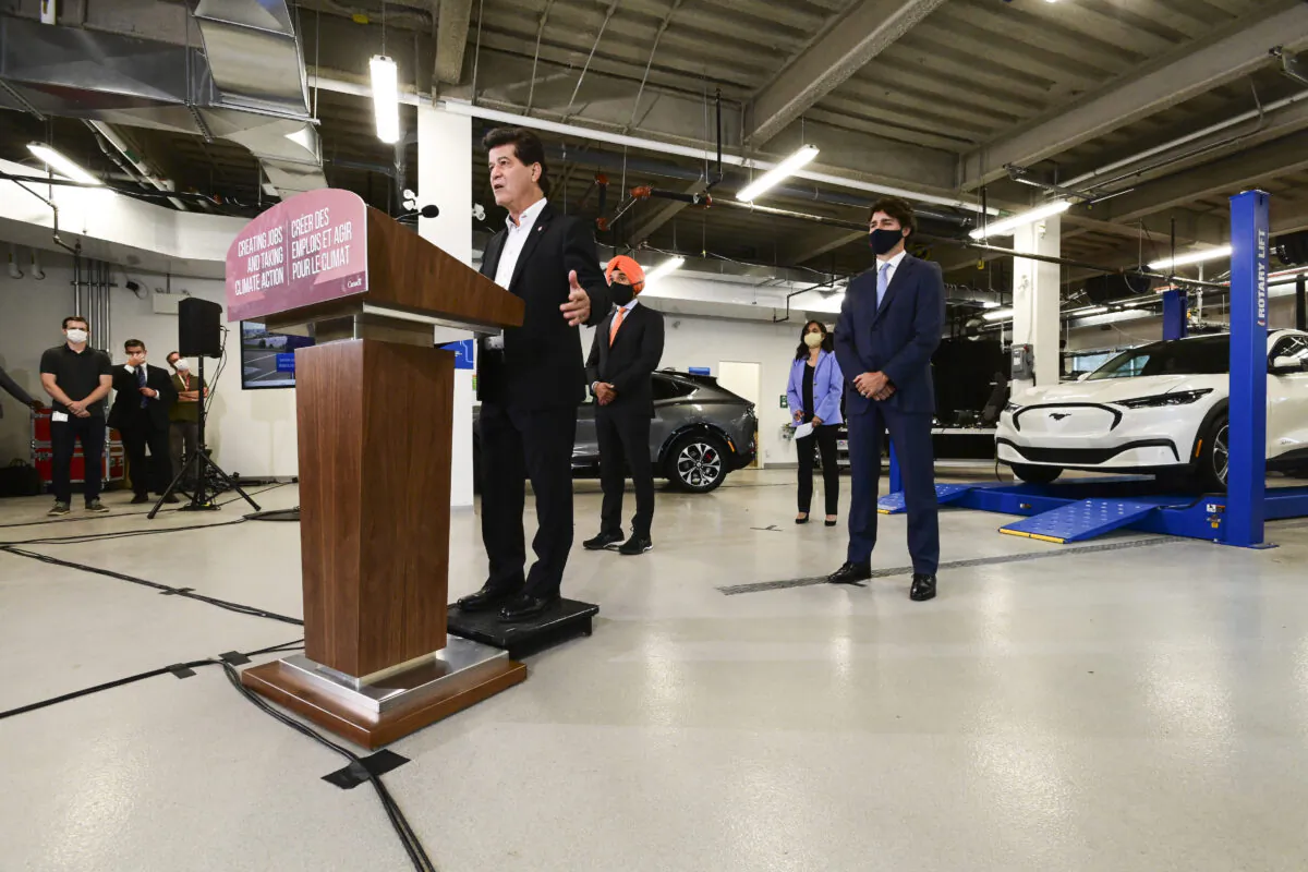 National President of Unifor Jerry Dias speaks as he is joined by Prime Minister Justin Trudeau, Minister of Public Services and Procurement Anita Anand, and Minister of Innovation, Science and Economic Development Navdeep Bains during a press conference at the Ford Connectivity and Innovation Centre in Ottawa, on Oct. 8 2020. (The Canadian Press/Sean Kilpatrick)