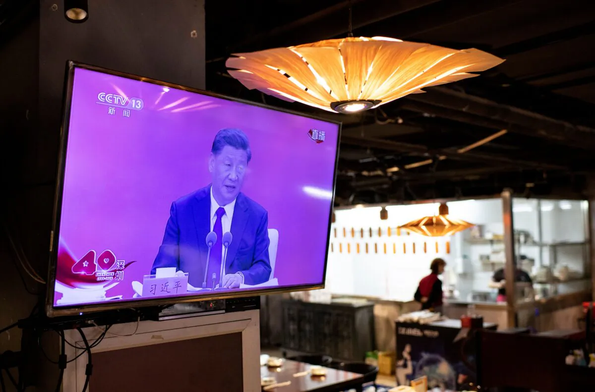A television screen at a restaurant in Beijing shows Chinese leader Xi Jinping speaking during a broadcast from Shenzhen at an event marking the 40th anniversary of the establishment of the Shenzhen Special Economic Zone on Oct.14, 2020. (Noel Celis/AFP via Getty Images)