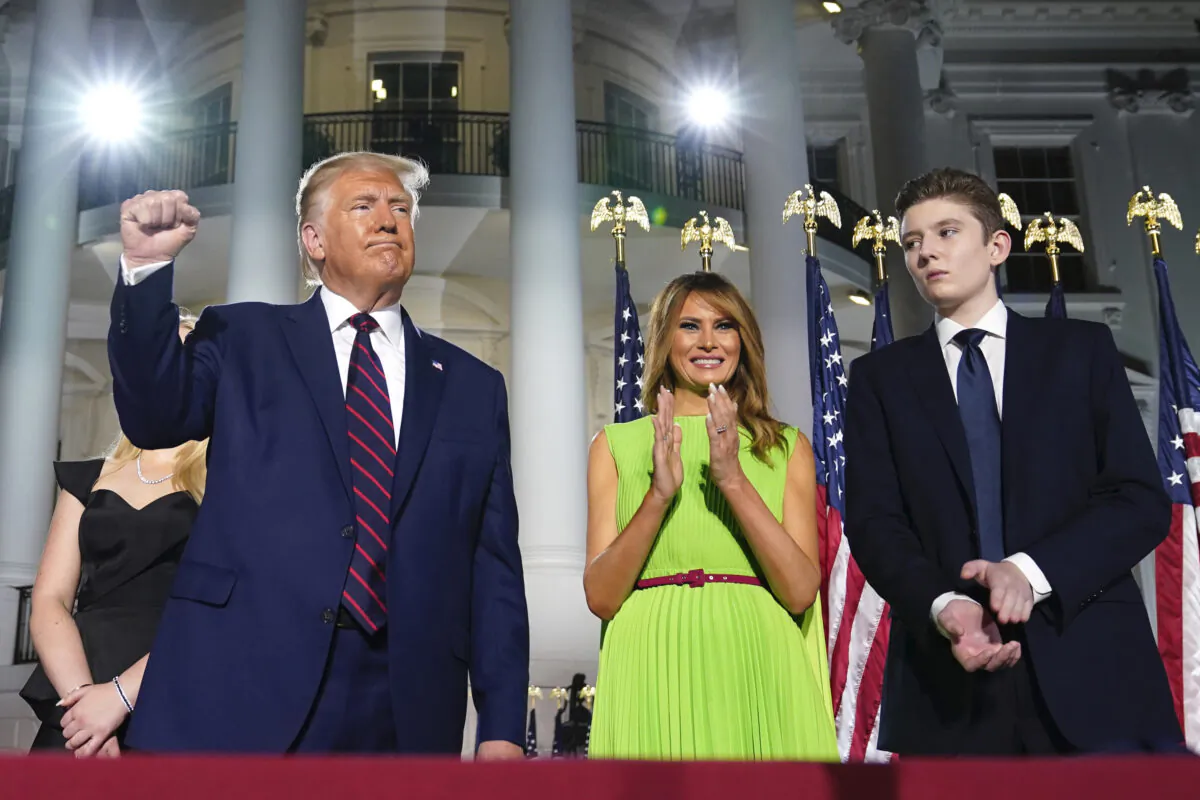 President Donald Trump, First Lady Melania Trump and Barron Trump stand on the South Lawn of the White House on the fourth day of the Republican National Convention, in Washington on Aug. 27, 2020. (Evan Vucci/AP Photo)