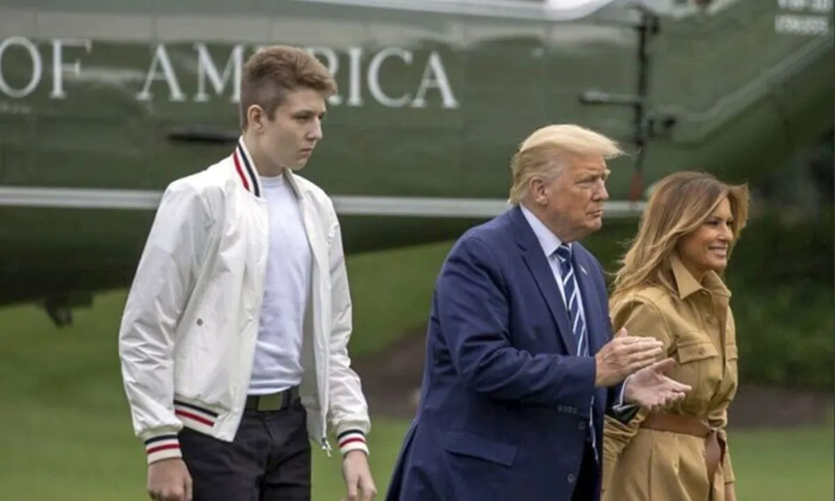 Barron Trump, then-President Donald Trump and then-First Lady Melania Trump walk on the South Lawn of the White House in Washington, on Aug. 16, 2020. (Tasos Katopodis/Getty Images)