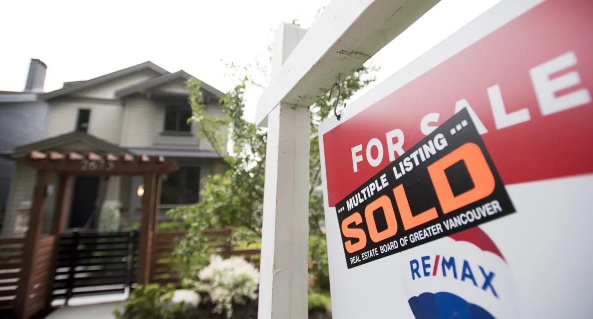 A real estate sign is pictured in Vancouver on June 12, 2018. The Canadian Real Estate Association says home sales rose hit a new record in September. (THE CANADIAN PRESS/Jonathan Hayward)