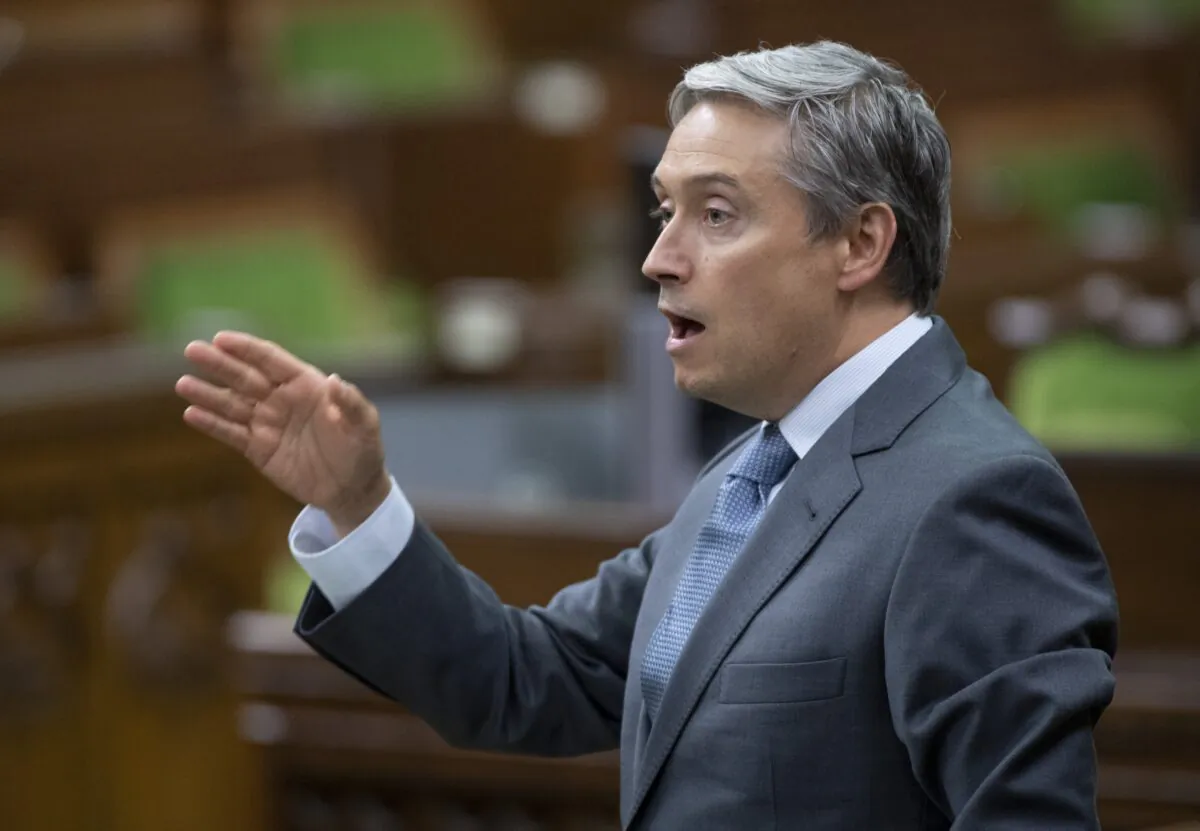 Foreign Affairs Minister Francois-Philippe Champagne rises during a sitting of the Special Committee on the COVID-19 Pandemic in the House of Commons in Ottawa on Aug. 12, 2020. (Adrian Wyld/The Canadian Press)