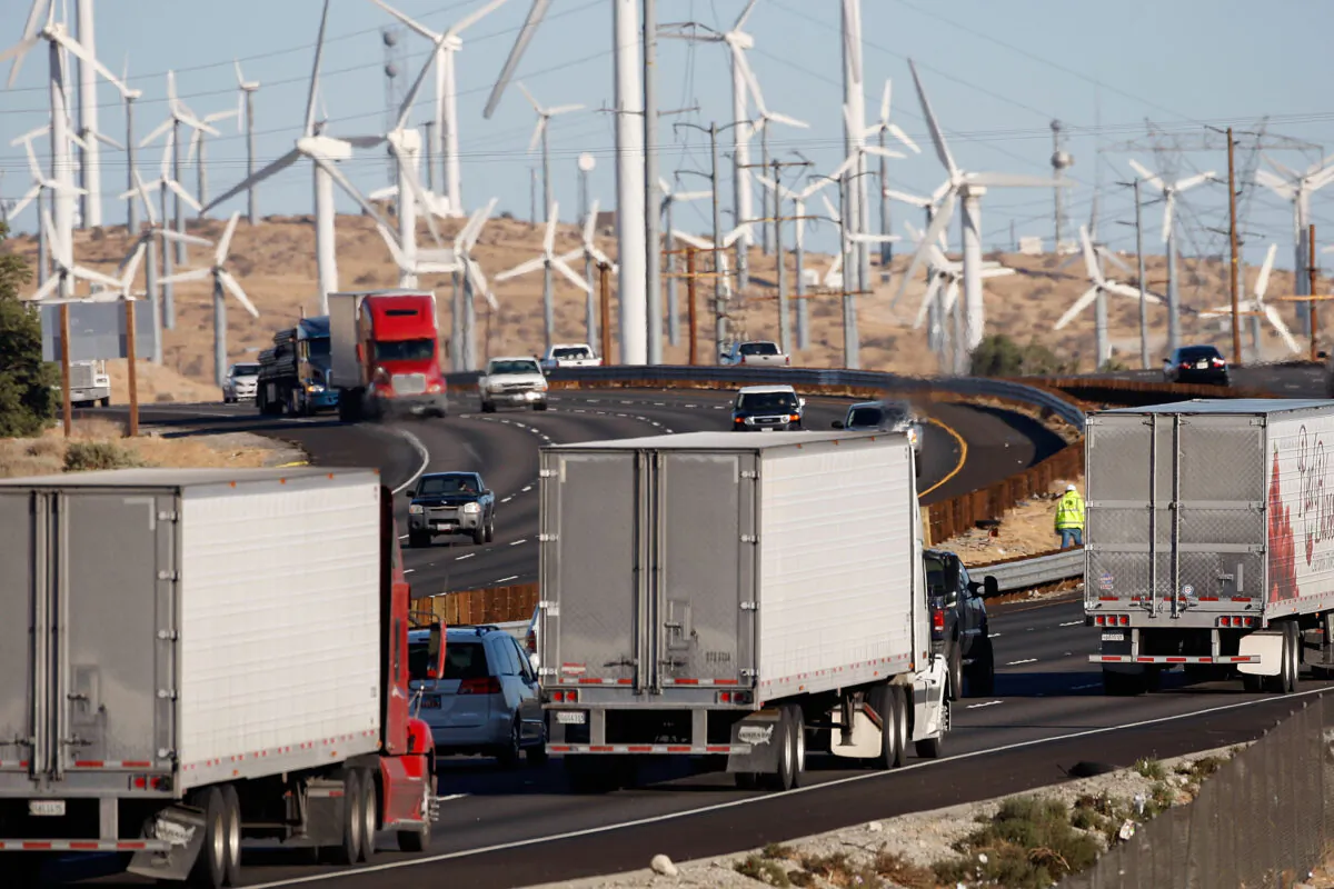 Trucks and cars pass windmills along the 10 freeway near Banning, Calif., on Dec. 8, 2009. (David McNew/Getty Images)