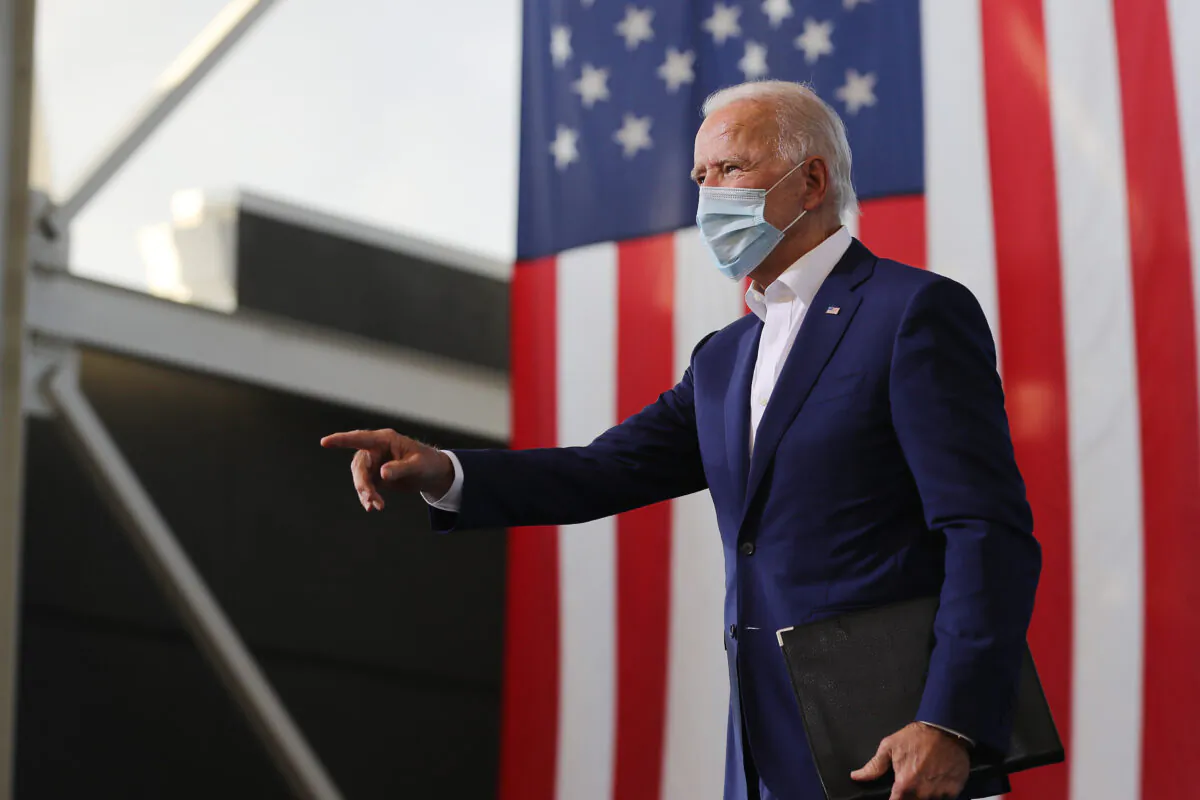Democratic presidential nominee Joe Biden points to supporters during a drive-in voter mobilization event at Miramar Regional Park in Miramar, Fla., Oct. 13, 2020. (Somodevilla/Getty Images)