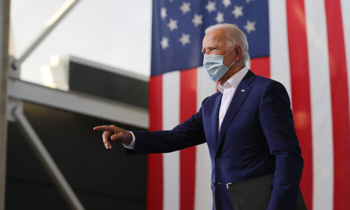 Democratic presidential nominee Joe Biden points to supporters during a drive-in voter mobilization event at Miramar Regional Park in Miramar, Fla., Oct. 13, 2020. (Somodevilla/Getty Images)