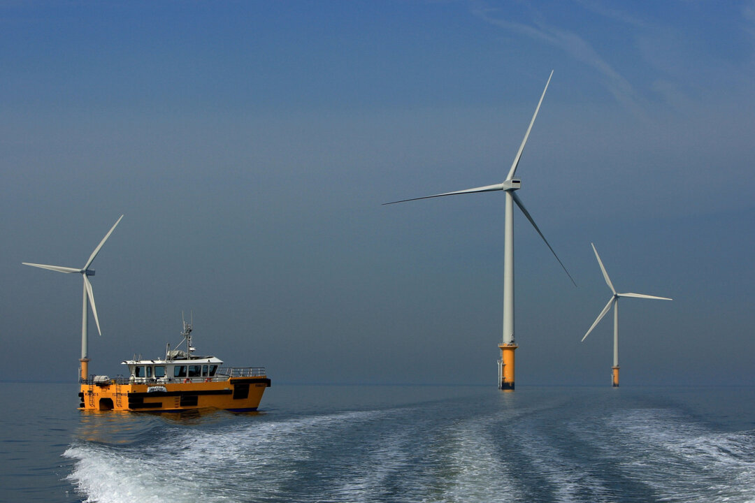 A maintenance boat works next to the turbines of the new Burbo Bank off shore wind farm in the mouth of the River Mersey on May 12, 2008 in Liverpool, England. (Christopher Furlong/Getty Images)