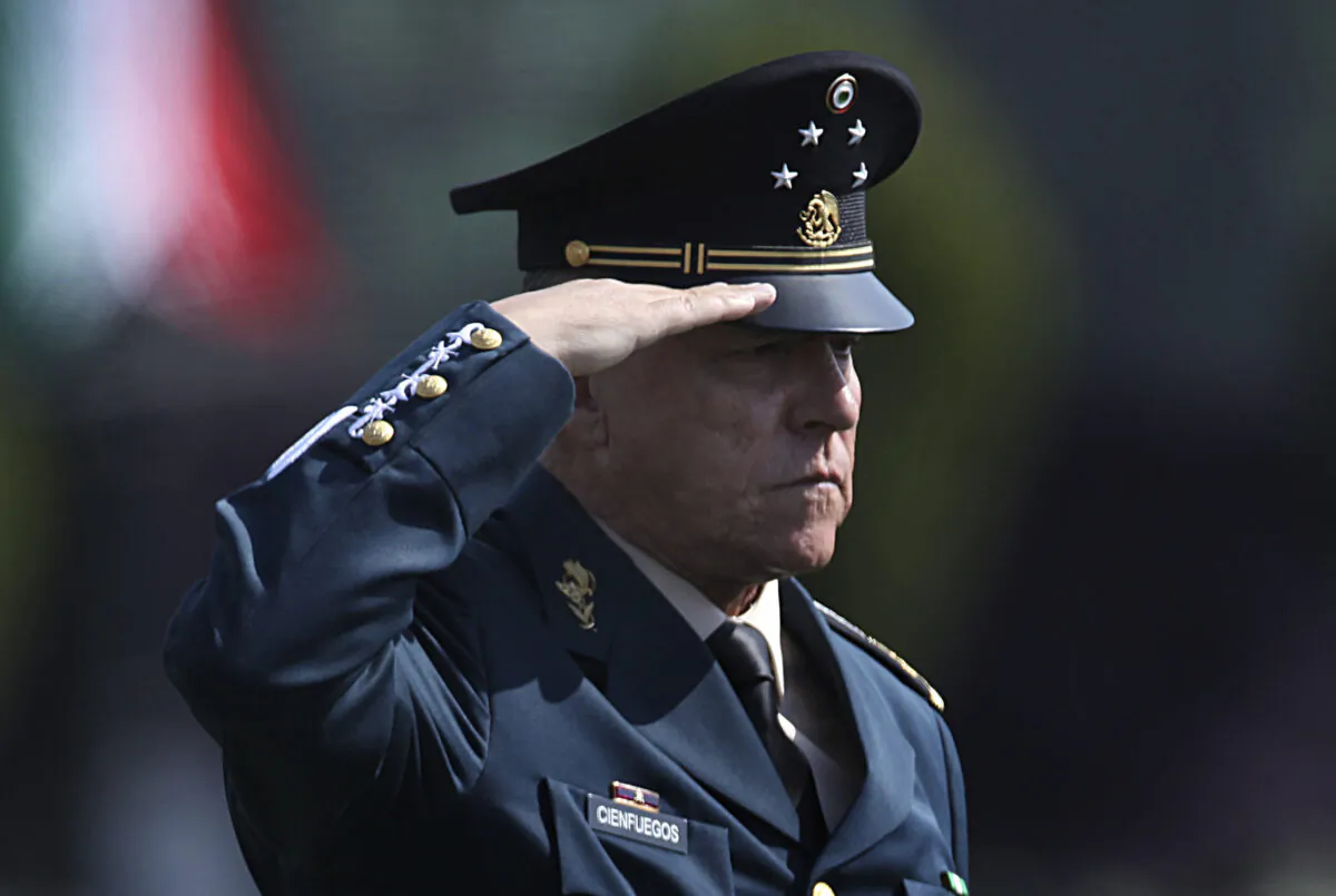 Mexico's then-Defense Secretary Gen. Salvador Cienfuegos Zepeda salutes soldiers at the Number 1 military camp in Mexico City, Mexico, on April 16, 2016. (Marco Ugarte/AP Photo)
