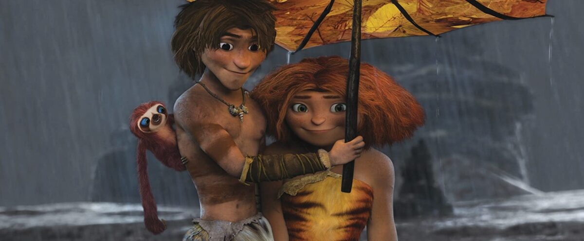 boy and girl and sloth under an umbrella in "The Croods"