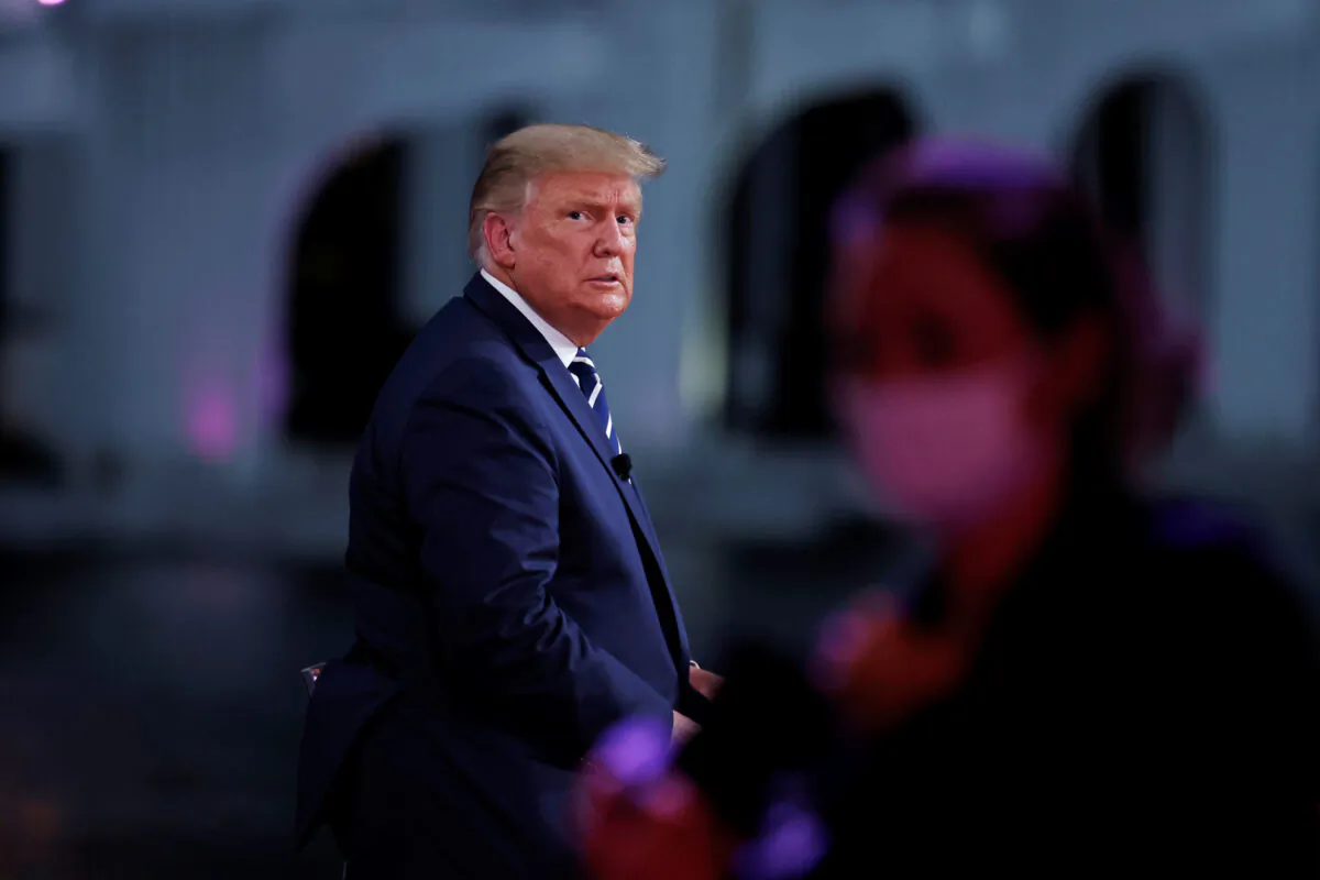 President Donald Trump looks on during a commercial break during a live 1-hour town hall forum with a group of Florida voters in Miami, Fla., on Oct. 15, 2020. (Carlos Barria/Reuters)