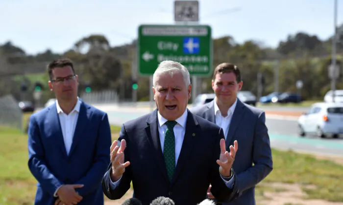Deputy Prime Minister Michael McCormack (C) speaks to media as Assistant Minister for Finance Zed Seselja (L) and ACT leader of the opposition Alistair Coe look on during a federal road infrastructure announcement on October 05, 2020 in Canberra, Australia. (Sam Mooy/Getty Images)