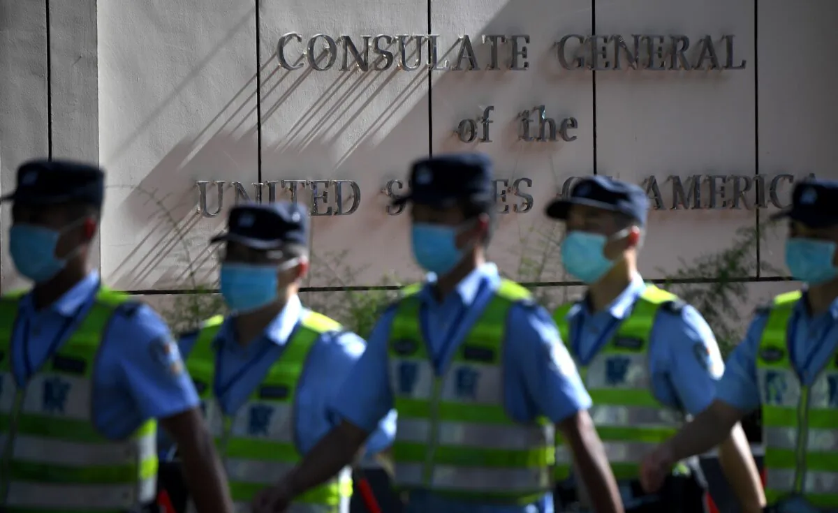 Policemen march in front of the US consulate in Chengdu, southwestern China's Sichuan Province, on July 26, 2020. (Noel Celis/AFP via Getty Images)