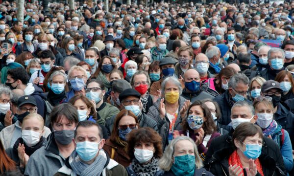 People gather on Republique square during a demonstration in Paris