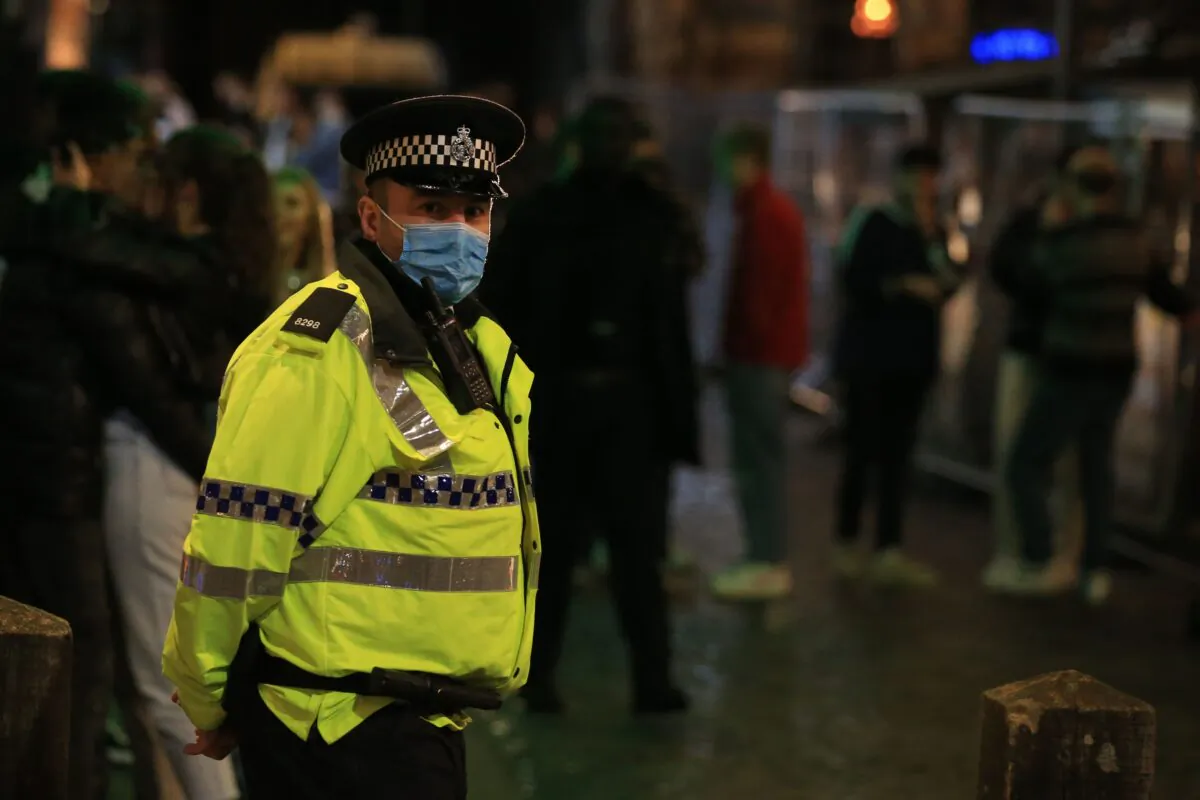Police patrol as revellers enjoy a night out in the centre of Liverpool, northwest England, on Oct. 10, 2020. (Lindsey Parnaby/AFP via Getty Images)