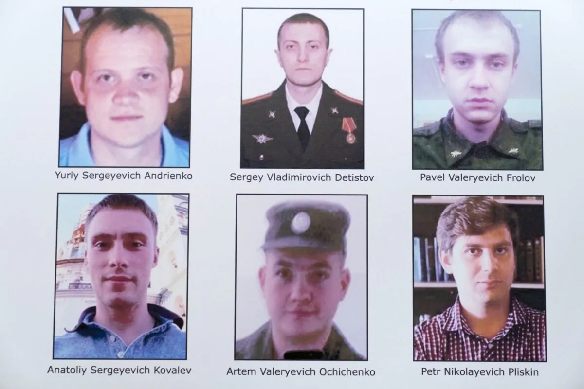 A poster showing six wanted Russian military intelligence officers is displayed before a news conference at the Department of Justice, in Washington on Oct. 19, 2020. (Andrew Harnik/AP Photo)