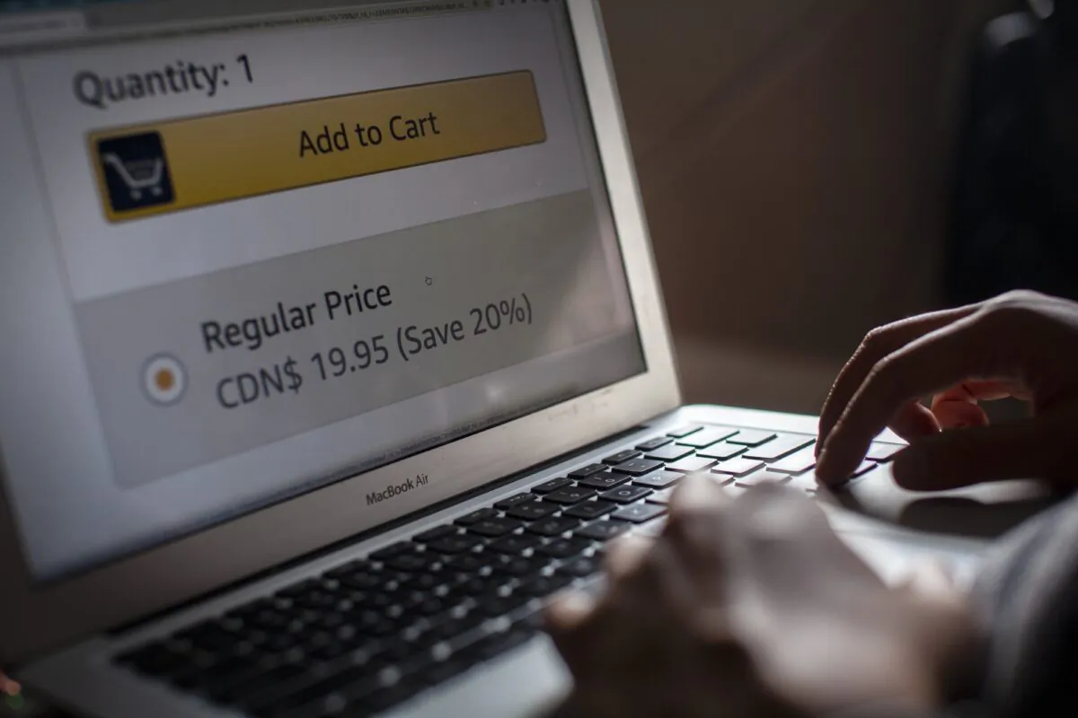 A person browses an e-commerce site on a computer in a photo illustration in Toronto, on Oct. 14, 2020. (Giordano Ciampini/The Canadian Press)
