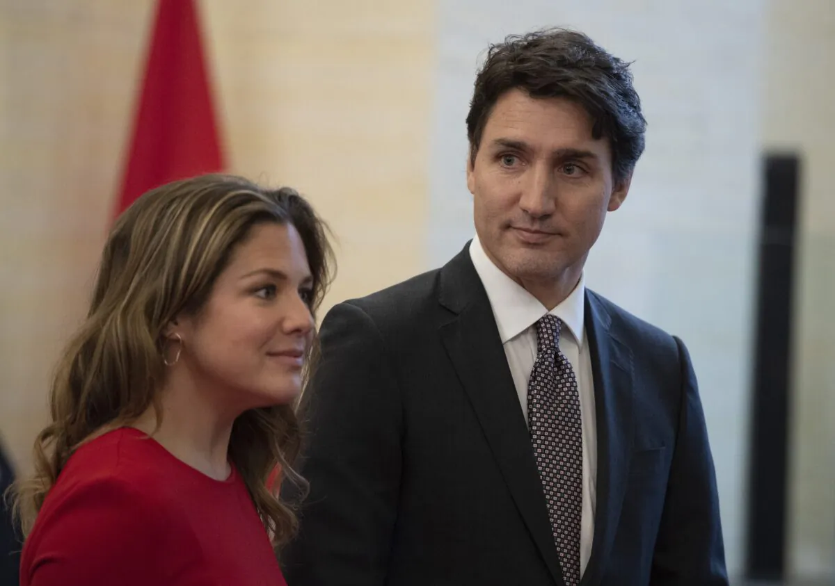 Prime Minister Justin Trudeau and his wife Sophie Gregoire wait for the arrival of Governor General Julie Payette before the Throne Speech at the Senate in Ottawa on Dec. 5, 2019. (Justin Tang/The Canadian Press)