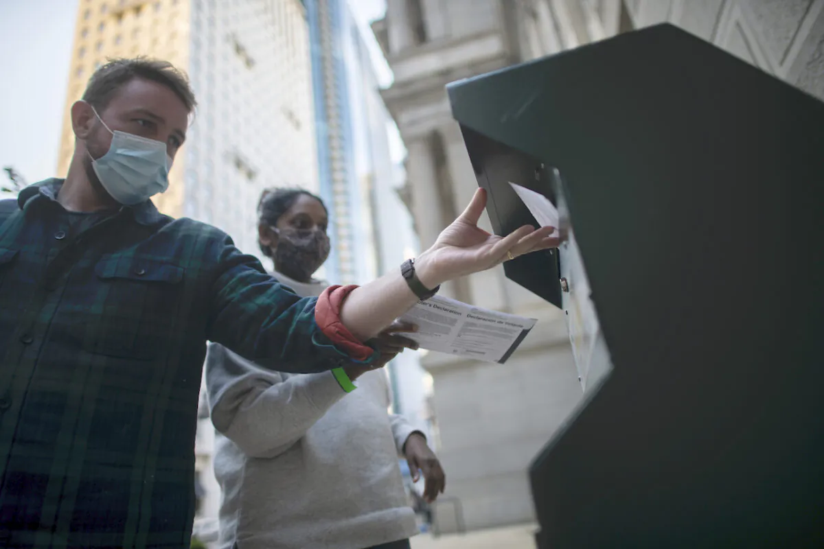 Voters cast their early voting ballot at drop box outside of City Hall in Philadelphia, Pa., on Oct. 17, 2020. (Mark Makela/Getty Images)
