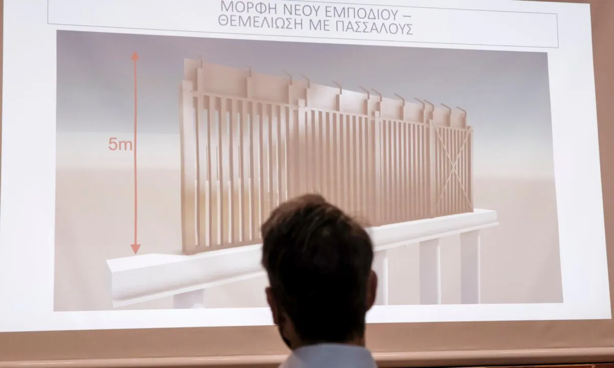 Greece's Prime Minister Kyriakos Mitsotakis attends a presentation of the construction of a new part of a fence which will be built at the border with Turkey, in Alexandroupolis, northern Greece, on Oct. 17, 2020. (Dimitris Papamitsos/Greek Prime Minister's Office via AP)