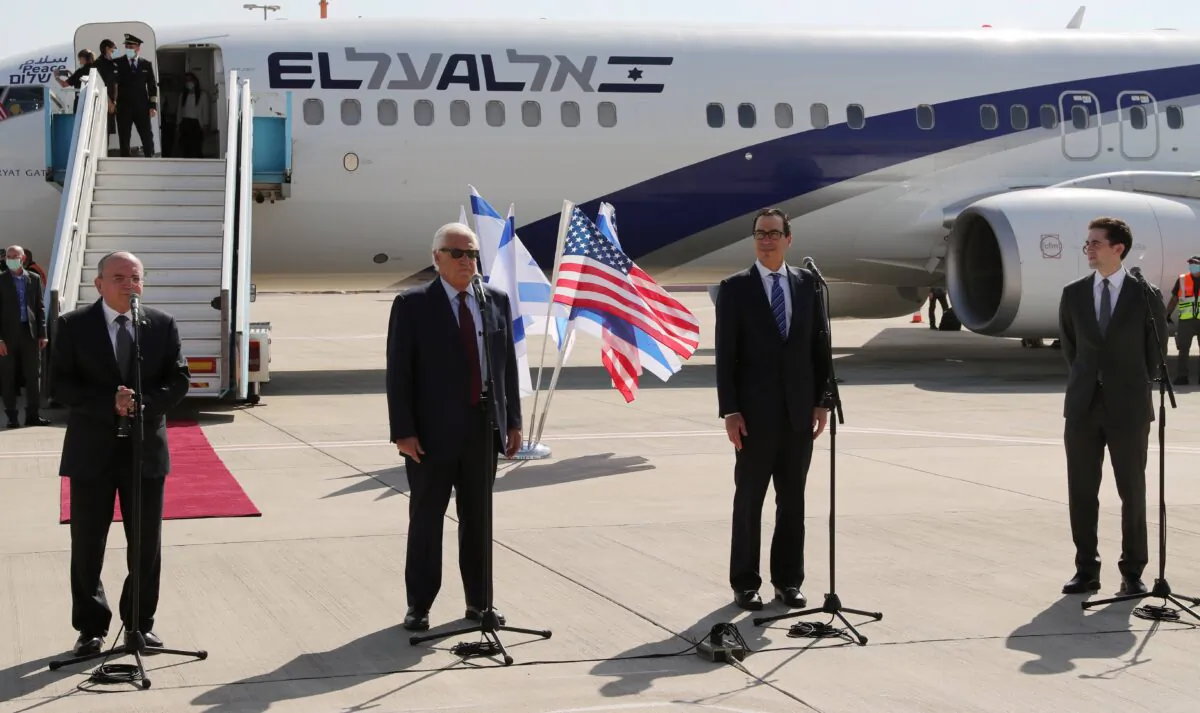 Israeli National Security Adviser Meir Ben-Shabbat, U.S. Ambassador to Israel David Friedman, U.S. Treasury Secretary Steve Mnuchin, and U.S. Middle East envoy Avi Berkowitz, deliver statements before boarding Israeli flag carrier El Al plane to Bahrain, at Ben Gurion International Airport in Lod, near Tel Aviv, Israel, on Oct. 18, 2020. (Ronen Zvulun/Pool/Reuters)