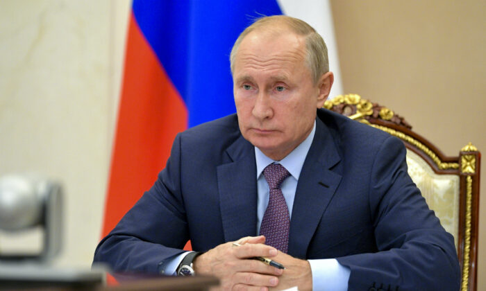Russian President Vladimir Putin chairs a Security Council meeting via video conference in Moscow, Russia, Wednesday, Oct. 14, 2020. (Alexei Druzhinin, Sputnik, Kremlin Pool Photo via AP)
