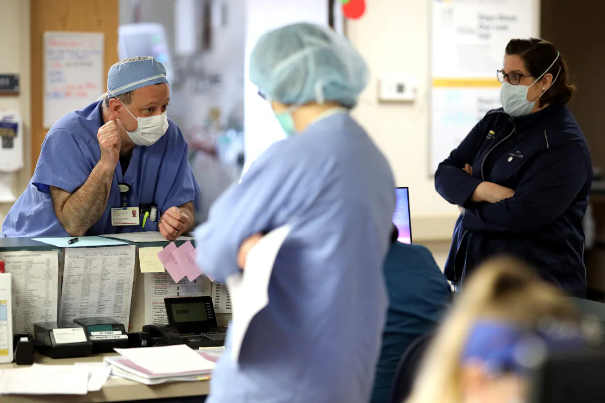 Doctors and nurses confer in a hospital in Leonardtown, Md., on April 8, 2020. (Win McNamee/Getty Images)