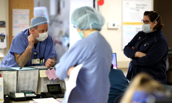 Doctors and nurses confer in a hospital in Leonardtown, Md., on April 8, 2020. (Win McNamee/Getty Images)
