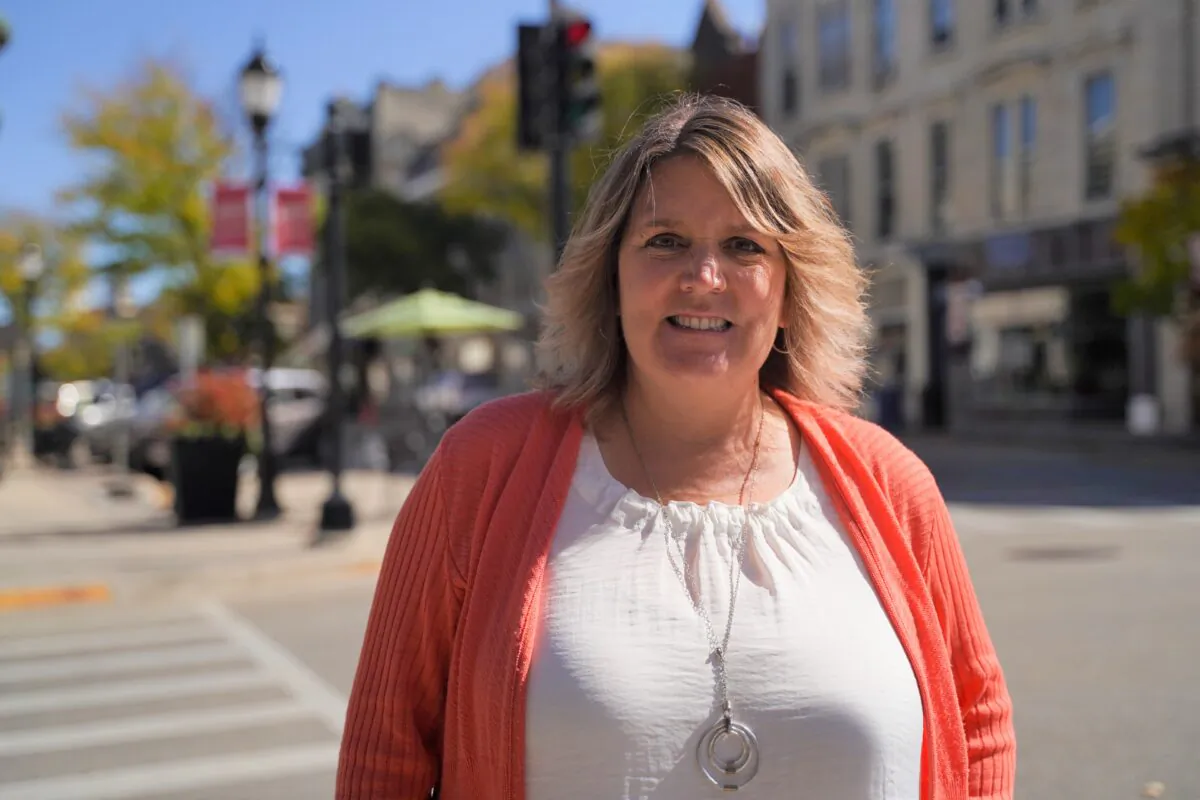 Kris Owens stands in downtown Waukesha, Wis., on Oct. 7, 2020. (Cara Ding/The Epoch Times)