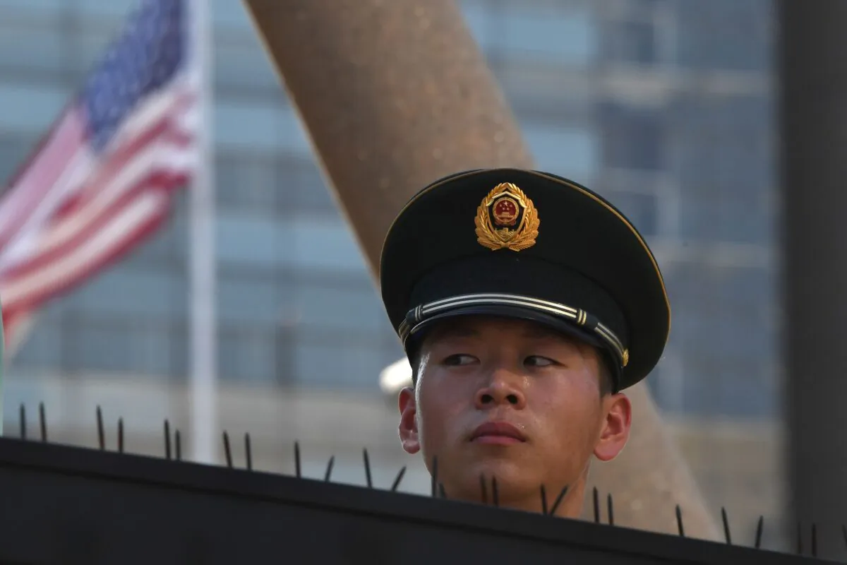 A policeman at the U.S. embassy in Beijing following a blast near the premises on July 26, 2018. (Greg Baker/AFP via Getty Images)
