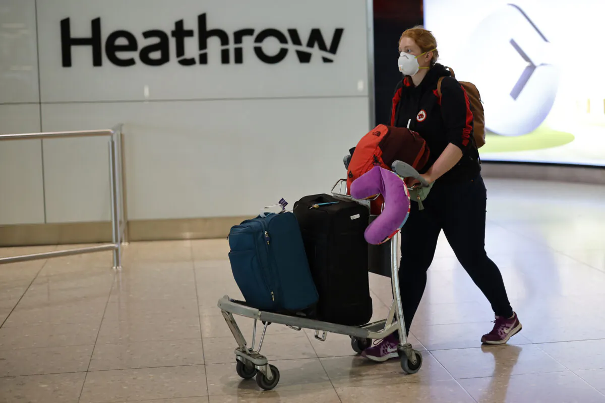 A passenger arrives at Terminal 2 of Heathrow airport in London on May 22, 2020. (Tolga Akmen/AFP via Getty Images)