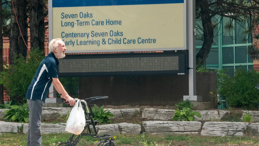 A man takes a walk outside the Seven Oaks Long-Term Care Home in Toronto on June 25, 2020. (The Canadian Press/Frank Gunn)