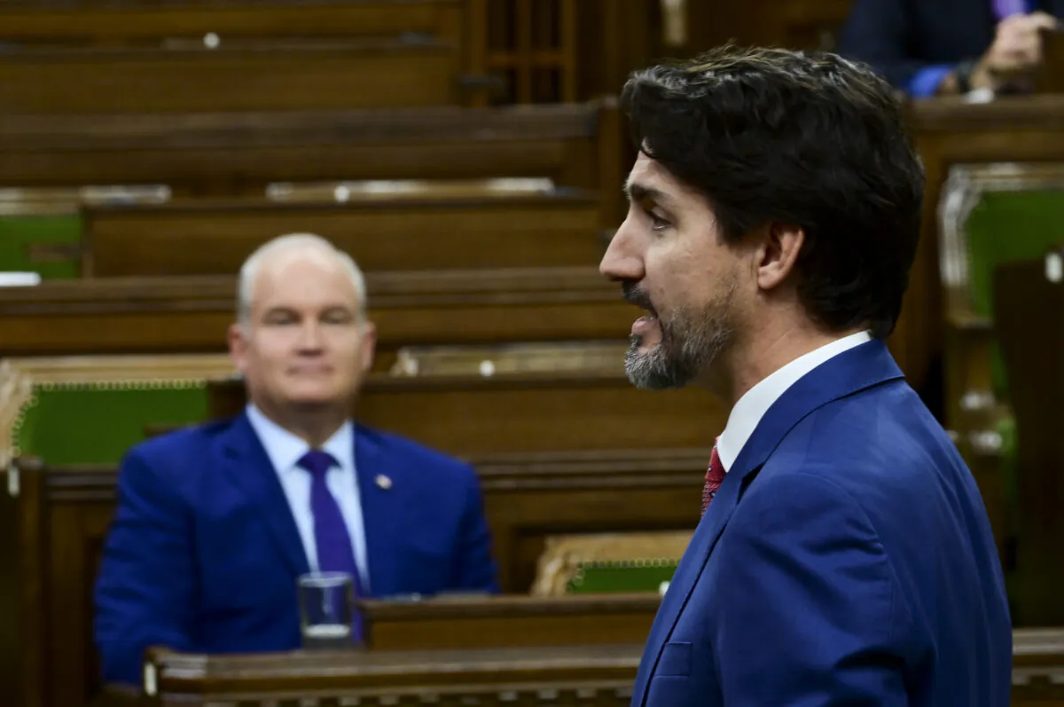 Prime Minister Justin Trudeau answers a question in the House of Commons as Conservative Leader Erin O'Toole looks on, on Parliament Hill in Ottawa on Wednesday, Oct. 21, 2020. (The Canadian Press/Sean Kilpatrick)