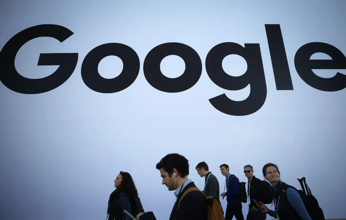 People walk past the Google pavilion at CES 2020 at the Las Vegas Convention Center on Jan. 8, 2020. (Mario Tama/Getty Images)