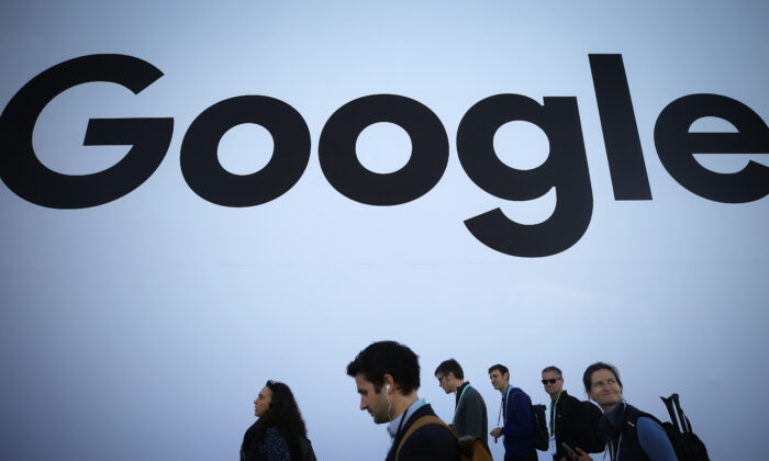 People walk past the Google pavilion at CES 2020 at the Las Vegas Convention Center on Jan. 8, 2020. (Mario Tama/Getty Images)
