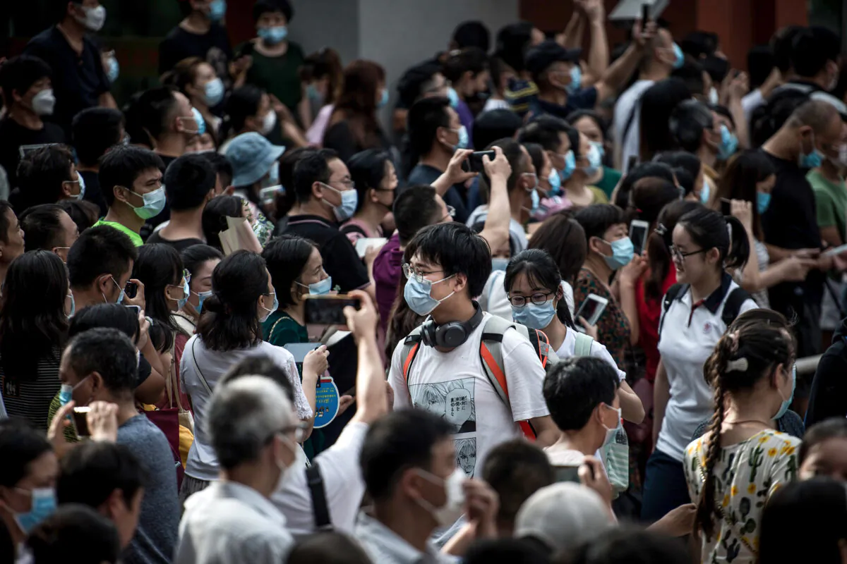 Students walk outside a school after finishing the National College Entrance Examination, known as "gaokao," outside a school in Wuhan in central China's Hubei Province on July 8, 2020. (STR/AFP via Getty Images)