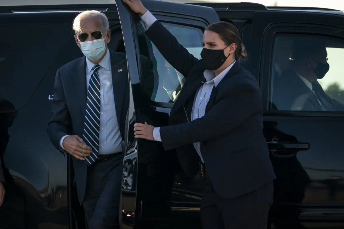 Democratic presidential nominee Joe Biden arrives to board his campaign plane at Raleigh-Durham International Airport in Morrisville, N.C., on Oct. 18, 2020. (Drew Angerer/Getty Images)