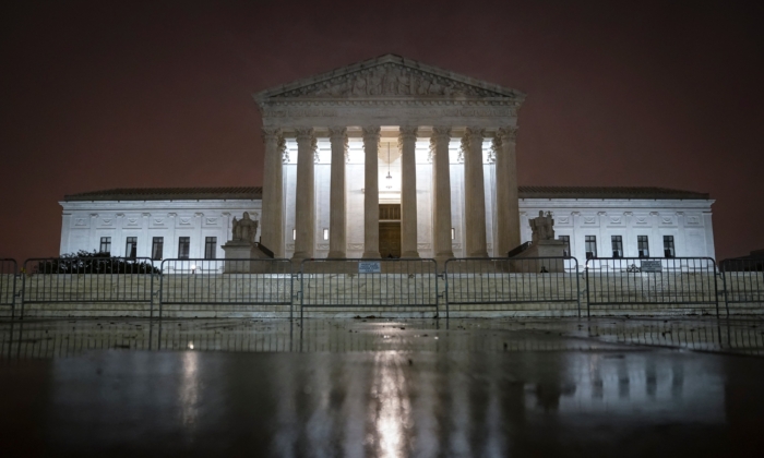 The Supreme Court is illuminated in Washington on Oct. 12, 2020. (Drew Angerer/Getty Images)