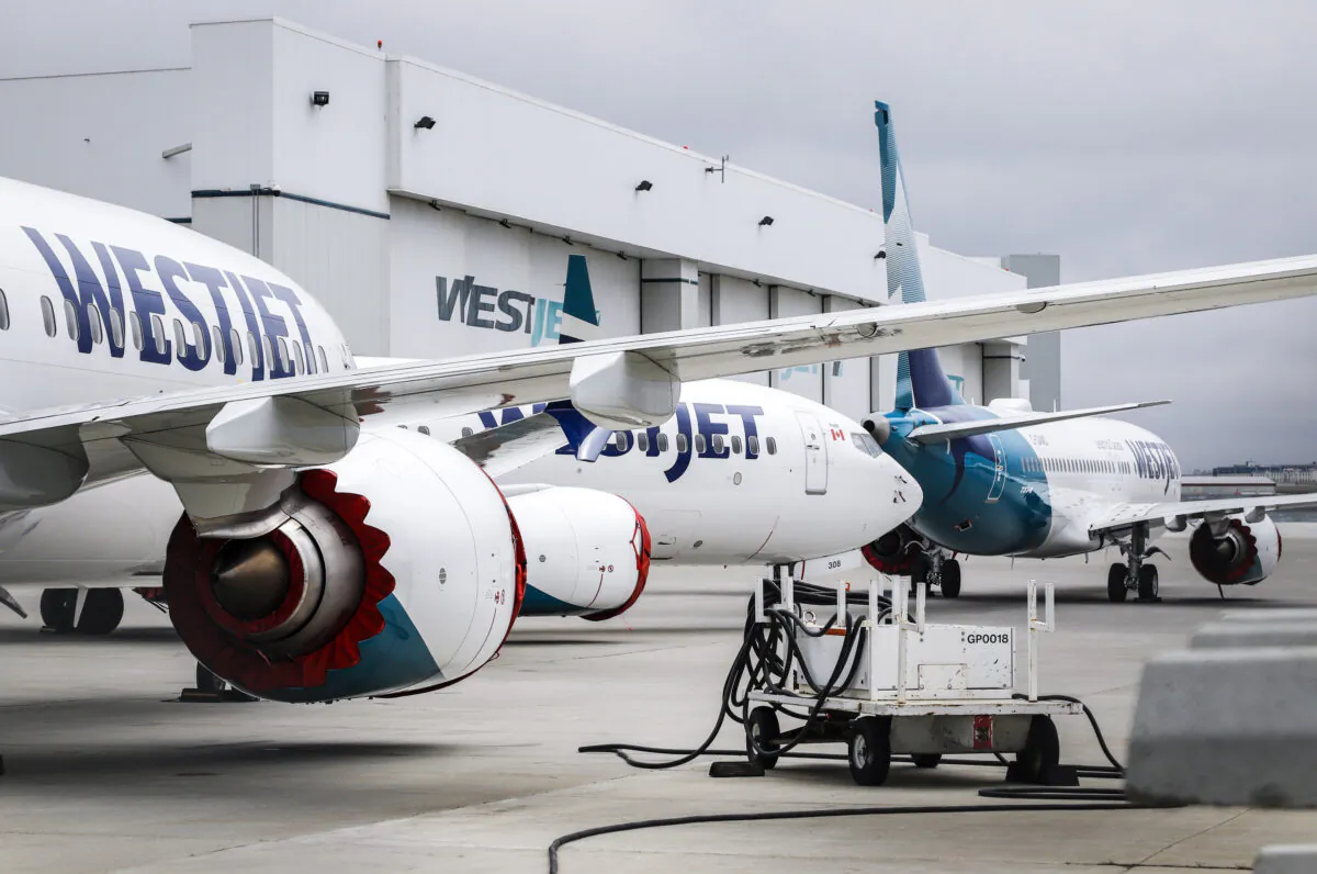 Grounded WestJet Boeing 737 Max aircraft are shown at the airline's facilities in Calgary on May 7, 2019. WestJet Airlines Ltd. has quietly changed its refund policy to allow some customers whose flights were cancelled due to the pandemic to reclaim their cash. (The Canadian Press/Jeff McIntosh)