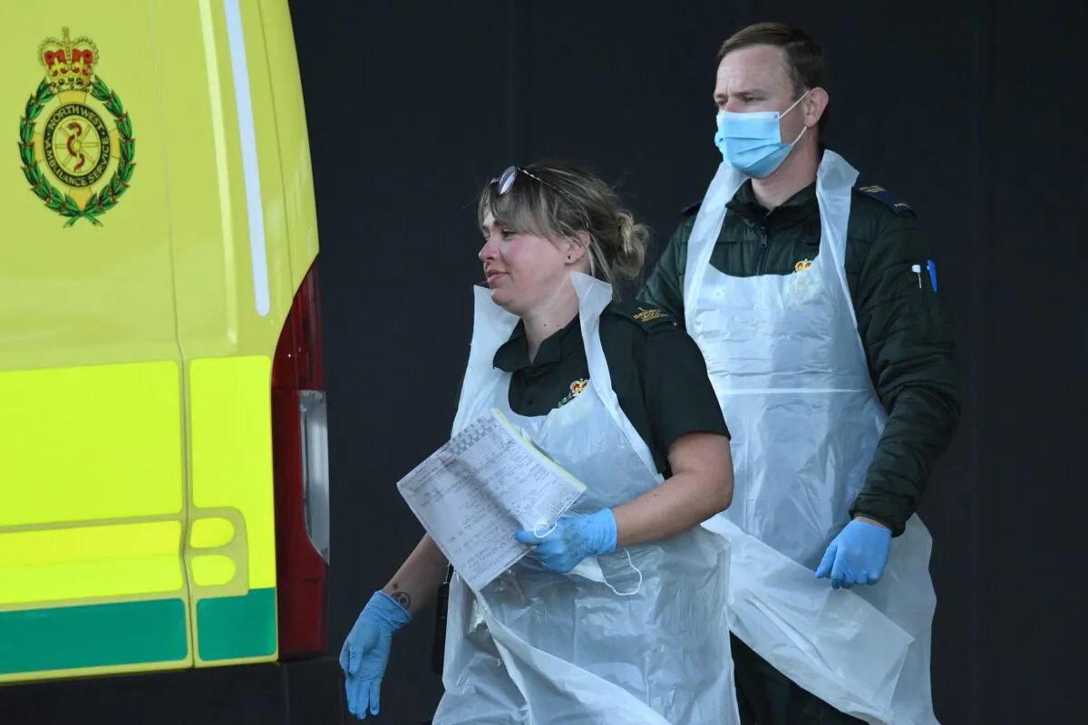Paramedics return to their ambulance at Aintree University Hospital in Liverpool, north west England on May 14, 2020. (Oli Scarff/AFP via Getty Images)
