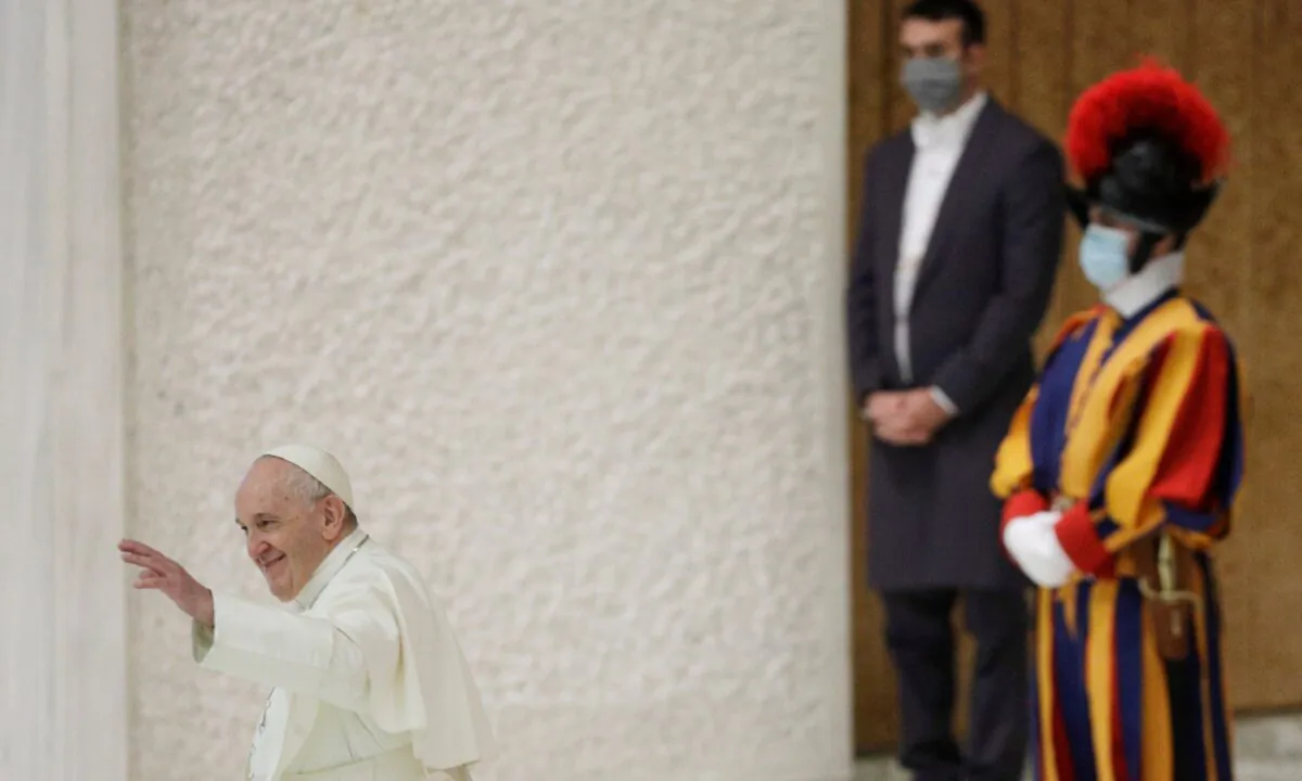 Pope Francis waves at the end of his weekly general audience in the Paul VI hall at the Vatican, on Oct. 21, 2020. (Gregorio Borgia/AP Photo)
